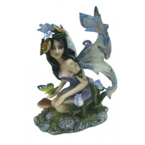 Figurine de fée sexy au papillon bleu